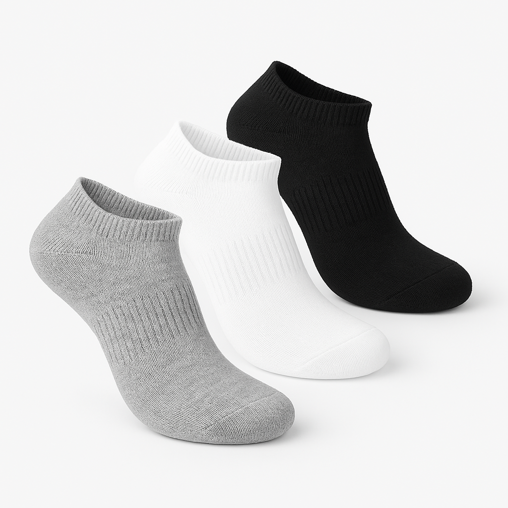 Three pairs of socks in black, white, and gray on a white background